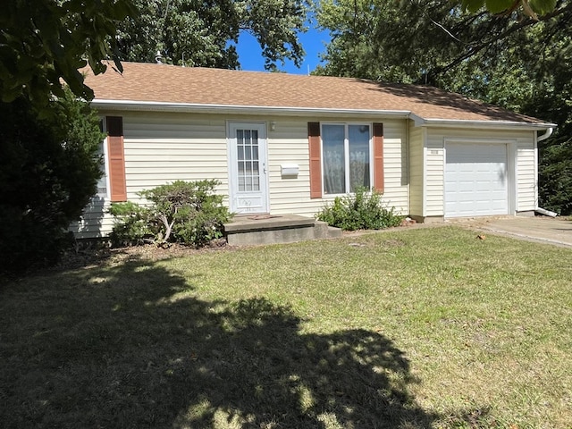 single story home with a front yard and a garage