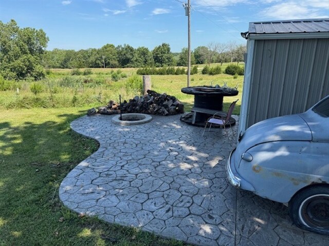 24240 State Highway T, Excello, MO 65247 - view of patio / terrace featuring an outdoor fire pit