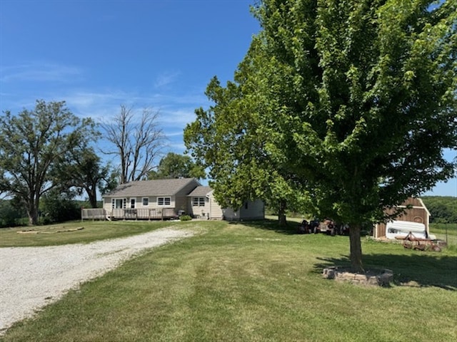 24240 State Highway T, Excello, MO 65247 - view of front of property featuring a front lawn, driveway, and a wooden deck