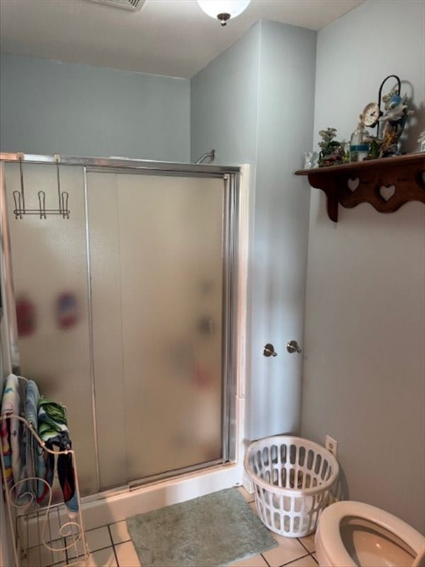 24240 State Highway T, Excello, MO 65247 - full bath with tile patterned flooring and a shower stall