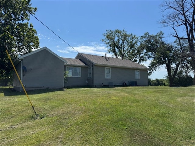 24240 State Highway T, Excello, MO 65247 - back of house featuring a lawn