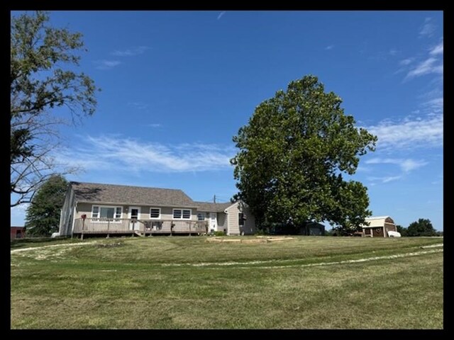 24240 State Highway T, Excello, MO 65247 - view of grassy yard with a deck