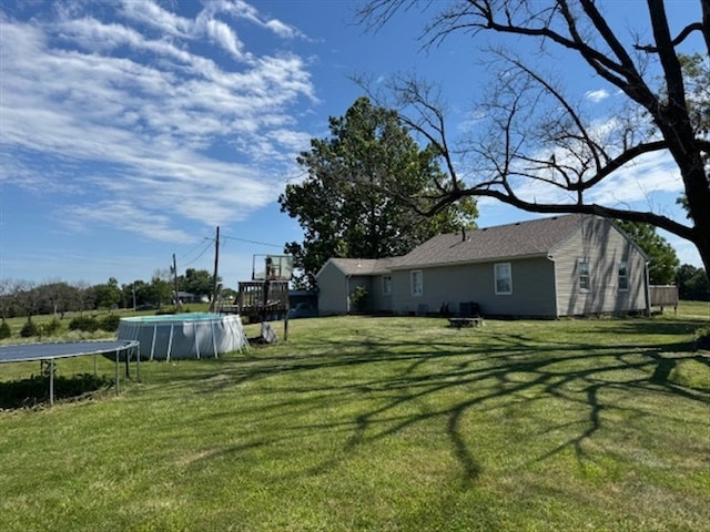 24240 State Highway T, Excello, MO 65247 - view of green lawn with an outdoor pool