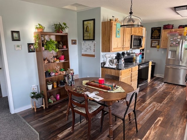 24240 State Highway T, Excello, MO 65247 - dining space with dark wood-style floors and baseboards