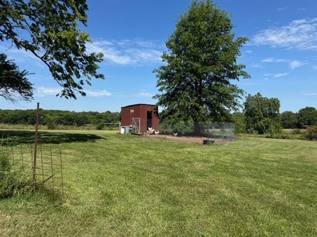 24240 State Highway T, Excello, MO 65247 - view of grassy yard featuring a storage unit