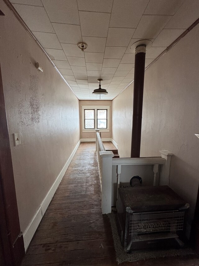 empty room with crown molding and dark hardwood / wood-style floors