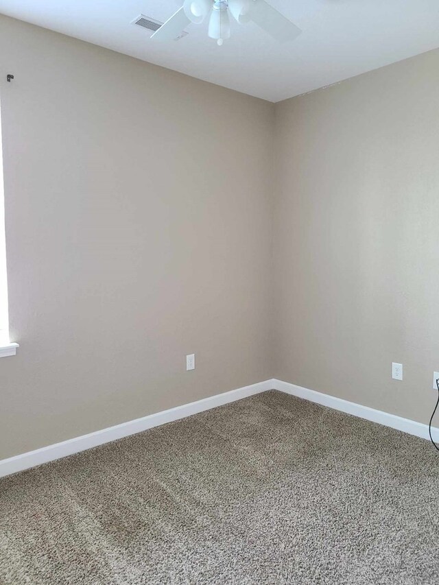 601/603 W Laharpe St, Kirksville, MO 63501 - carpeted empty room with visible vents, baseboards, and a ceiling fan