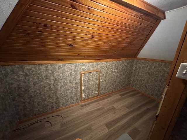 bonus room featuring wood ceiling, hardwood / wood-style floors, and lofted ceiling