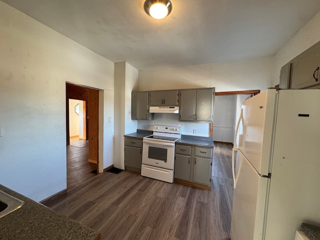 kitchen featuring white appliances, gray cabinetry, and dark wood-type flooring