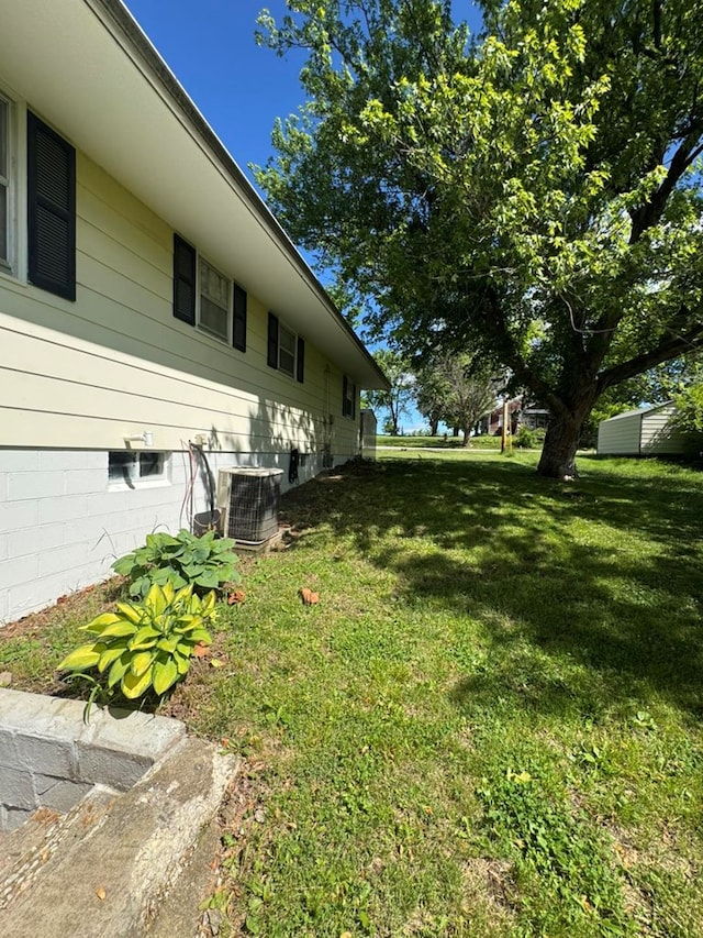 236 N Maple St, Milan, MO 63556 - view of grassy yard featuring cooling unit