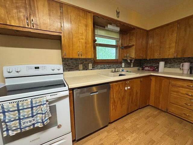 236 N Maple St, Milan, MO 63556 - kitchen featuring electric stove, dishwasher, a sink, tasteful backsplash, and light countertops