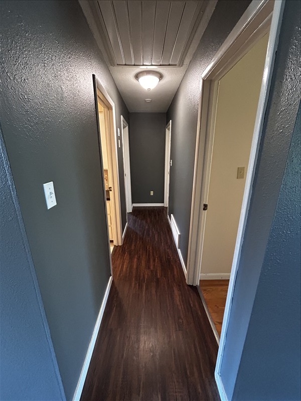 804 Maple Ln, Macon, MO 63552 - corridor featuring wood finished floors and baseboards