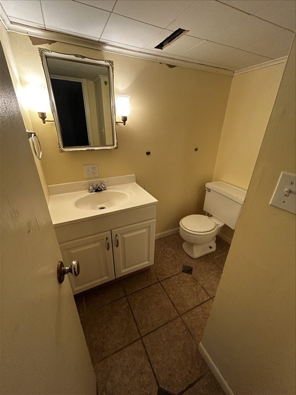 804 Maple Ln, Macon, MO 63552 - half bathroom featuring vanity, tile patterned floors, and a paneled ceiling