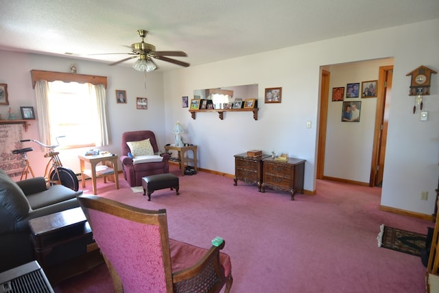 carpeted living room featuring ceiling fan and a textured ceiling