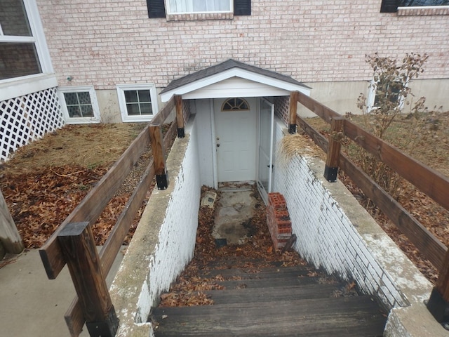 property entrance with brick siding