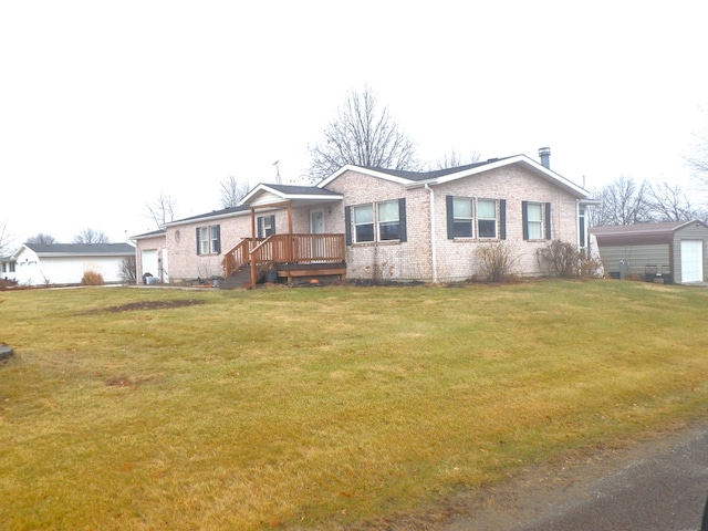 single story home featuring a front lawn, an attached garage, and brick siding