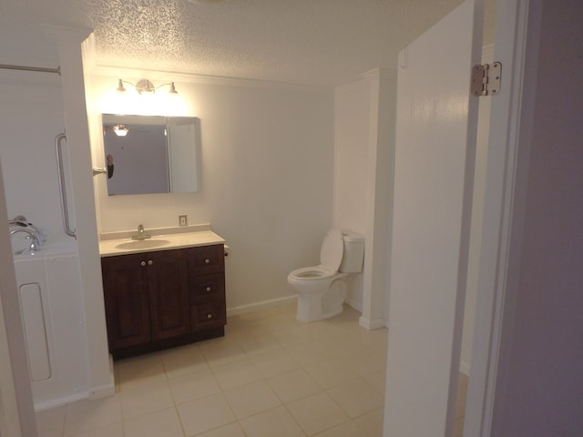 bathroom with toilet, a textured ceiling, vanity, and tile patterned floors