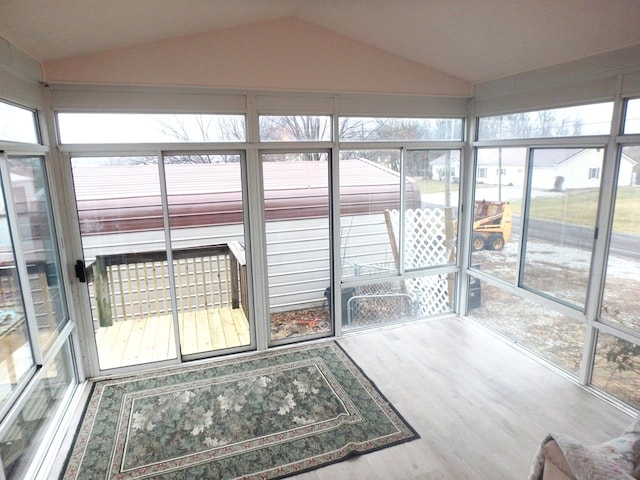 sunroom / solarium with vaulted ceiling