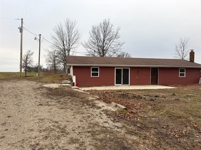 rear view of house with a patio