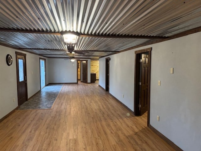 unfurnished room featuring ceiling fan and hardwood / wood-style flooring