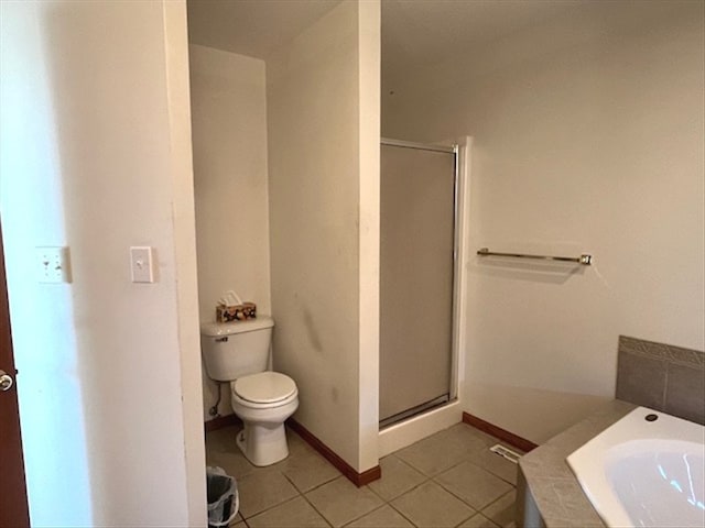 bathroom with tile patterned floors, toilet, and plus walk in shower