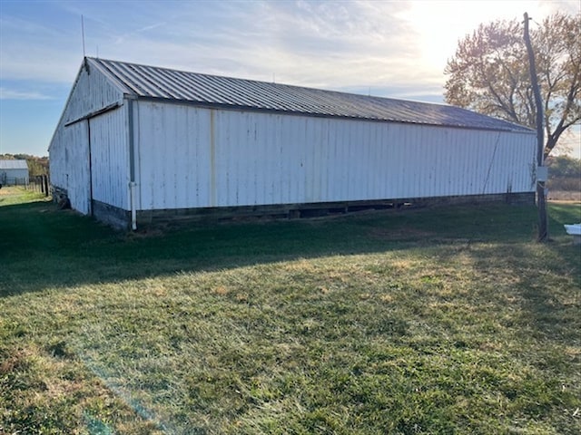 view of outdoor structure with a lawn