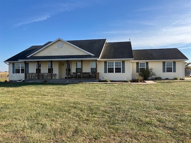 ranch-style house with a front lawn and a porch