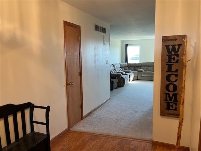 hall with light hardwood / wood-style flooring