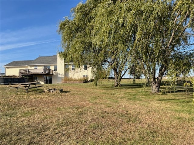 view of yard featuring a wooden deck