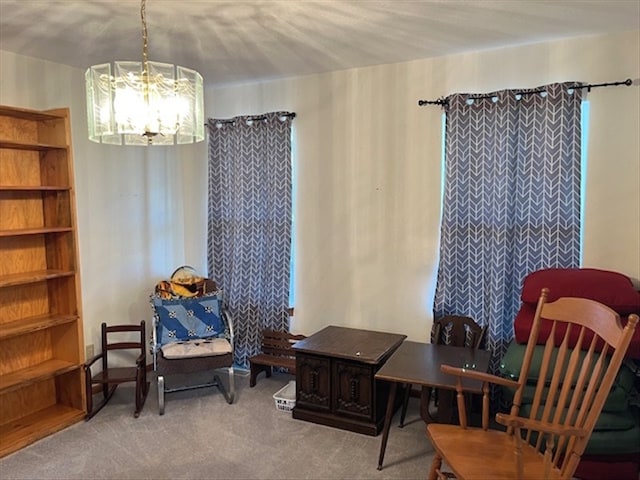 living area featuring carpet and a notable chandelier