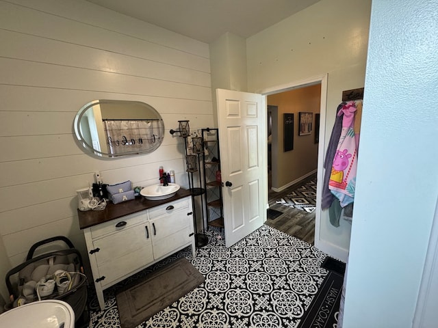 1203 E Randolph St, Kirksville, MO 63501 - corridor featuring a sink and wooden walls