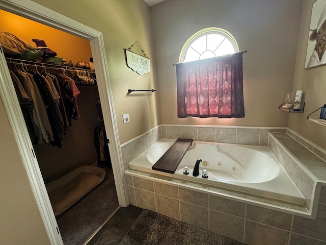 1203 E Randolph St, Kirksville, MO 63501 - full bath featuring a tub with jets, tile patterned floors, and a spacious closet