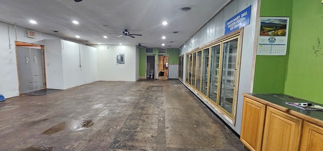 100 Pleasant St, Cincinnati, IA 52549 - hall with recessed lighting, concrete floors, and electric panel