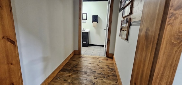 100 Pleasant St, Cincinnati, IA 52549 - hallway featuring wood-type flooring and baseboards