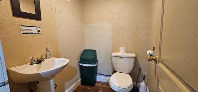 100 Pleasant St, Cincinnati, IA 52549 - half bath with toilet and wood finished floors