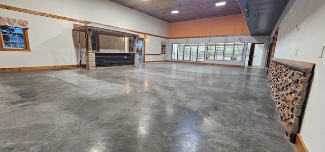 100 Pleasant St, Cincinnati, IA 52549 - unfurnished living room with recessed lighting and concrete flooring