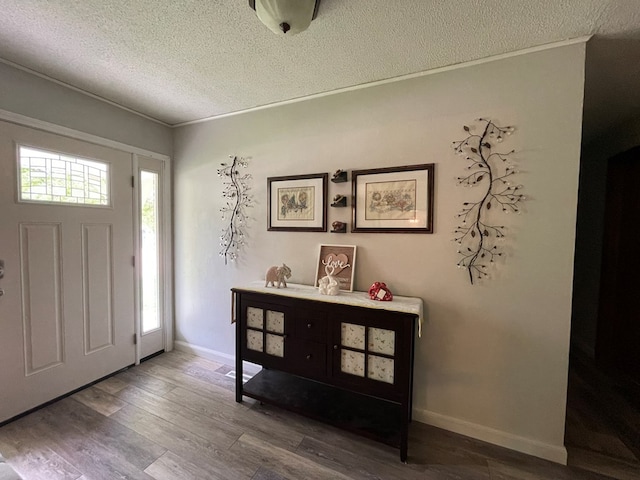820 Fairlane Dr, Chillicothe, MO 64601 - foyer entrance with a textured ceiling, wood finished floors, and baseboards