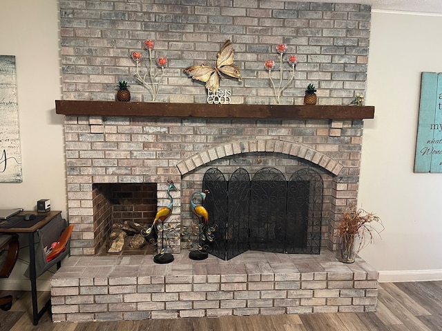 820 Fairlane Dr, Chillicothe, MO 64601 - detailed view of a fireplace, wood finished floors, ornamental molding, and baseboards