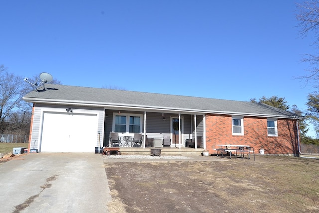 view of front of home featuring a porch and a garage