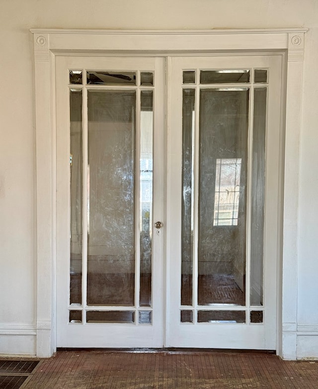 property entrance featuring french doors