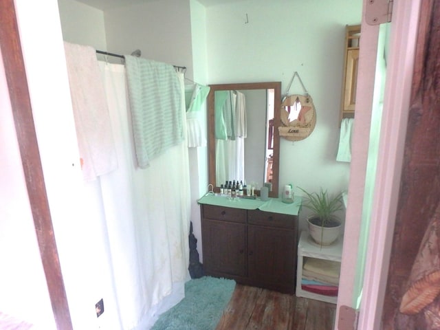 bathroom featuring hardwood / wood-style flooring and vanity