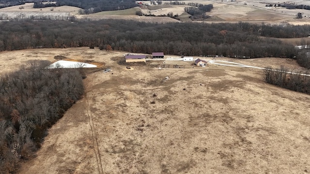 birds eye view of property featuring a rural view