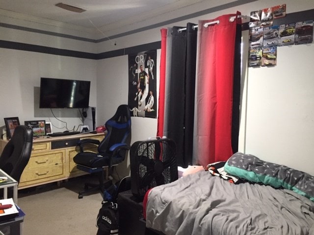 carpeted bedroom featuring vaulted ceiling