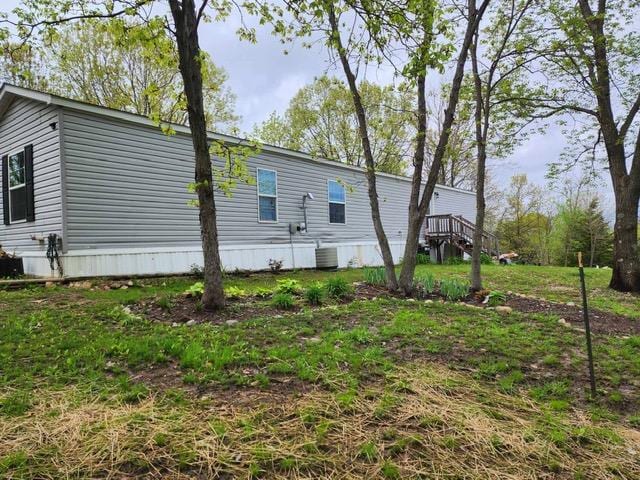 back of property featuring central AC unit