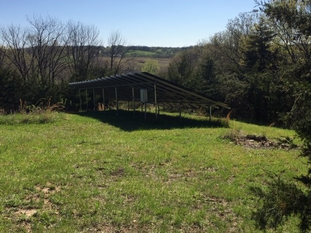 exterior space featuring a yard and a rural view