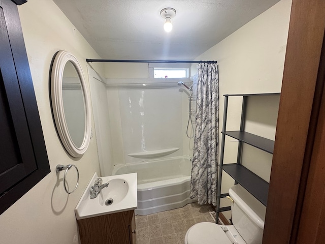 full bathroom featuring vanity, shower / bath combo with shower curtain, and toilet