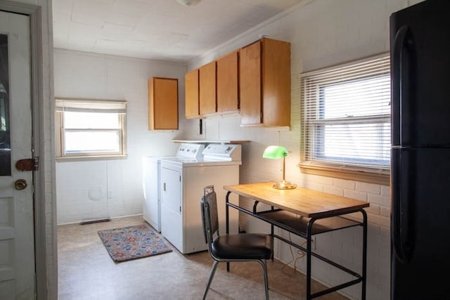 laundry area with separate washer and dryer