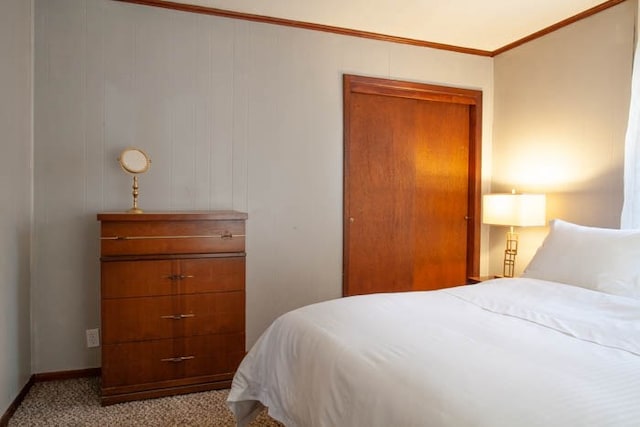 carpeted bedroom with ornamental molding