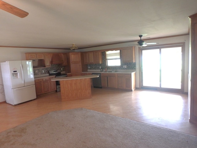 kitchen with electric range, light hardwood / wood-style flooring, dishwasher, a kitchen island, and white fridge with ice dispenser