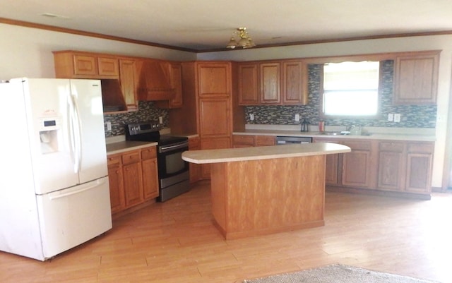 kitchen featuring a center island, white refrigerator with ice dispenser, crown molding, black electric range, and extractor fan